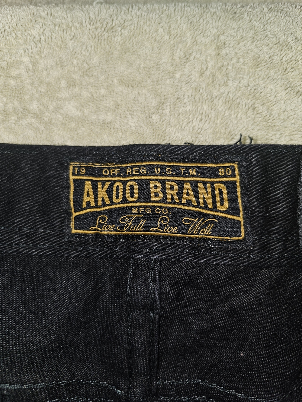 Akoo Black Straight Jeans with Gold Logo Stitching